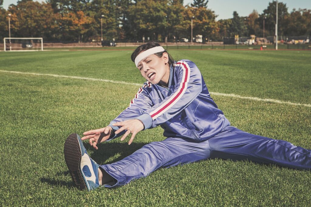 stretching, sports, woman, athlete, fitness, sport, healthy, exercise, workout, young, female, body, lifestyle, training, fit, nature, health, stretch, people, active, girl, adult, person, sportswear, athletic, gym, exercising, physical, sporty, white, pilates, leisure, tracksuit, track and field, shoes, headband, grass, field
